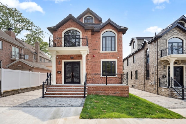 35-26 221st St, Bayside, NY 11361 - view of front of home featuring a balcony, french doors, brick siding, and entry steps