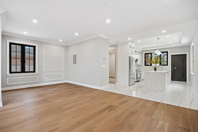 35-26 221st St, Bayside, NY 11361 - unfurnished living room with recessed lighting, light wood-style floors, crown molding, and electric panel
