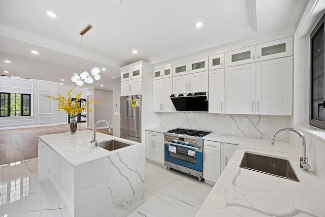 35-26 221st St, Bayside, NY 11361 - kitchen with appliances with stainless steel finishes, recessed lighting, decorative backsplash, ventilation hood, and a center island with sink
