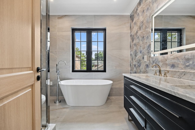 35-26 221st St, Bayside, NY 11361 - bathroom with vanity, tile walls, and a freestanding tub