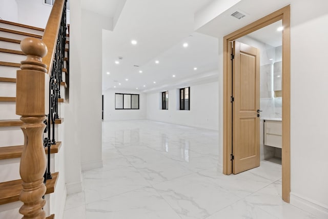 35-26 221st St, Bayside, NY 11361 - corridor featuring light marble finish flooring, stairs, and recessed lighting