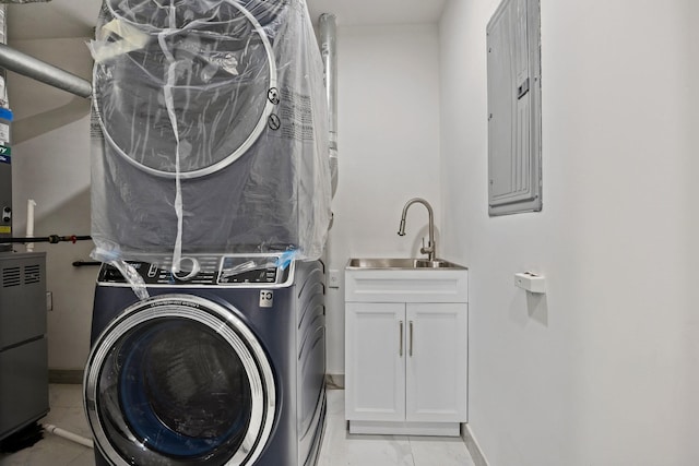 35-26 221st St, Bayside, NY 11361 - laundry room featuring stacked washer and clothes dryer, electric panel, cabinet space, light marble finish flooring, and heating unit