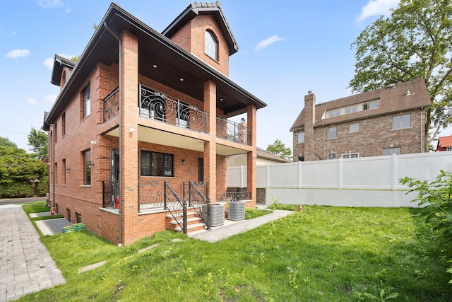 35-26 221st St, Bayside, NY 11361 - rear view of property with a balcony and brick siding