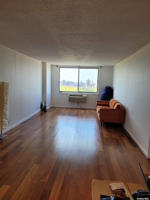 118-17 Union Tpke Unit 14E, Forest Hills, NY 11375 - sitting room with a textured ceiling and dark wood finished floors