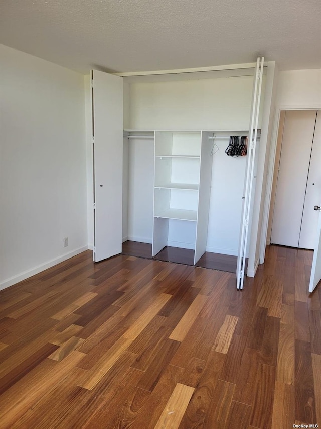 118-17 Union Tpke Unit 14E, Forest Hills, NY 11375 - unfurnished bedroom with wood finished floors and a closet