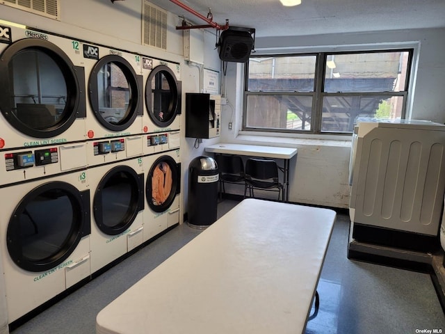 118-17 Union Tpke Unit 14E, Forest Hills, NY 11375 - community laundry with stacked washer and clothes dryer and washer and dryer