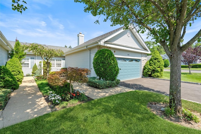 575 Mirror Pond Ct, Moriches, NY 11955 - view of property exterior with concrete driveway, an attached garage, a lawn, a chimney, and roof with shingles