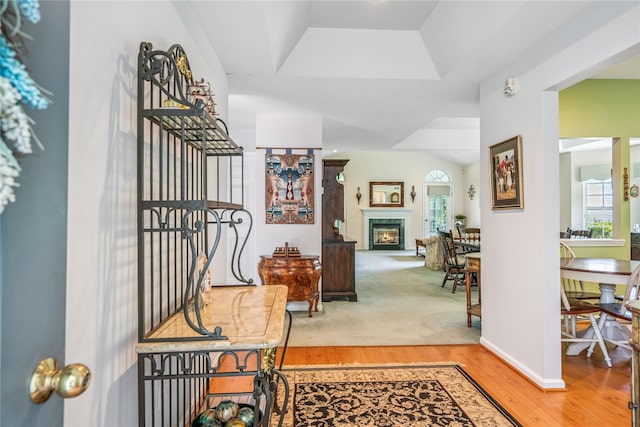 575 Mirror Pond Ct, Moriches, NY 11955 - entryway featuring plenty of natural light, wood finished floors, and a glass covered fireplace