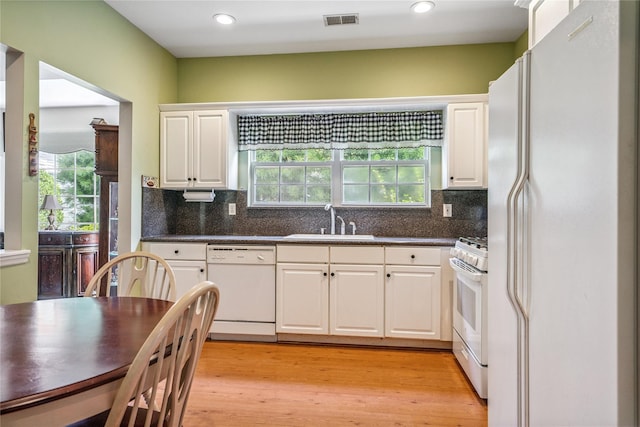575 Mirror Pond Ct, Moriches, NY 11955 - kitchen featuring white appliances, dark countertops, white cabinetry, tasteful backsplash, and recessed lighting