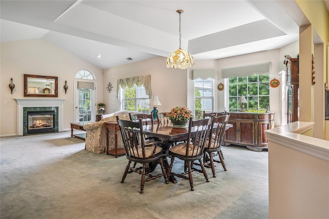 575 Mirror Pond Ct, Moriches, NY 11955 - dining area with light carpet, lofted ceiling, and a high end fireplace