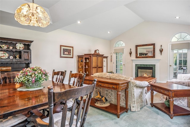 575 Mirror Pond Ct, Moriches, NY 11955 - dining space with vaulted ceiling, carpet floors, a fireplace, and recessed lighting