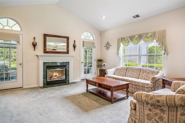 575 Mirror Pond Ct, Moriches, NY 11955 - carpeted living area with vaulted ceiling and a premium fireplace
