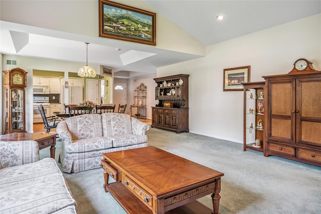 575 Mirror Pond Ct, Moriches, NY 11955 - living area featuring lofted ceiling, light carpet, a skylight, and recessed lighting