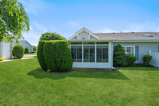 575 Mirror Pond Ct, Moriches, NY 11955 - rear view of house with a lawn, a shingled roof, and a sunroom