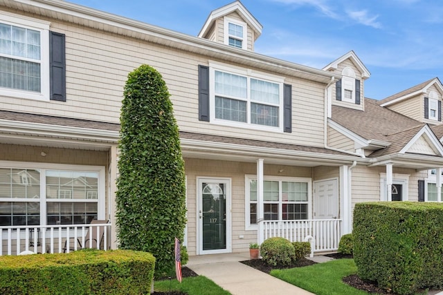 117 Willow Ln, Valley Stream, NY 11580 - view of front of house with covered porch and a shingled roof