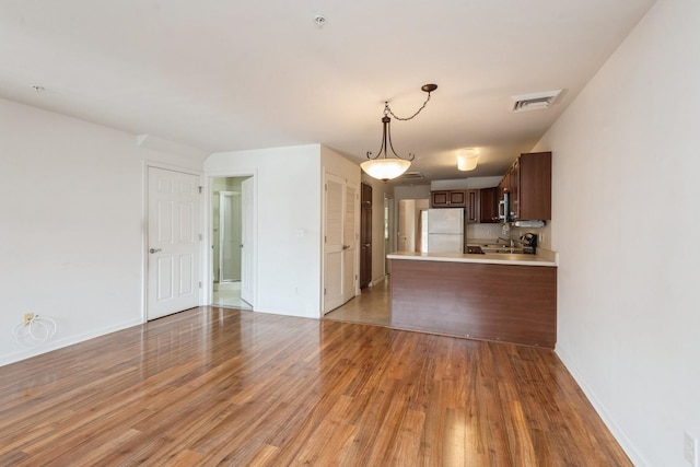 117 Willow Ln, Valley Stream, NY 11580 - unfurnished living room with light wood-type flooring and baseboards