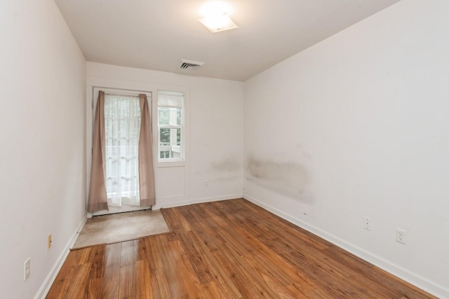 117 Willow Ln, Valley Stream, NY 11580 - empty room featuring wood finished floors and baseboards