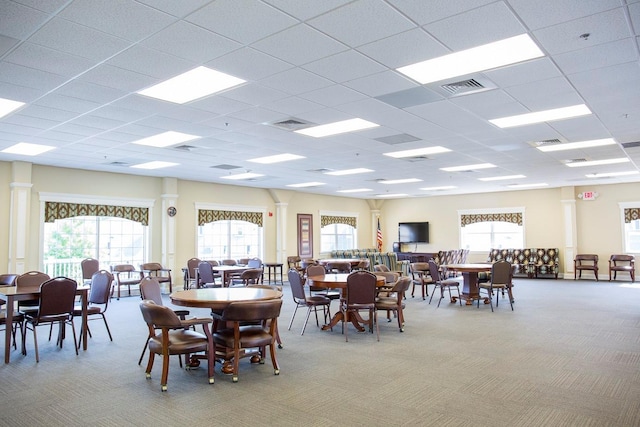 117 Willow Ln, Valley Stream, NY 11580 - dining room with light carpet, healthy amount of natural light, a drop ceiling, and decorative columns