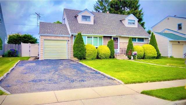 145 Dartmouth Dr, Hicksville, NY 11801 - cape cod house with an attached garage, gravel driveway, roof with shingles, and a gate
