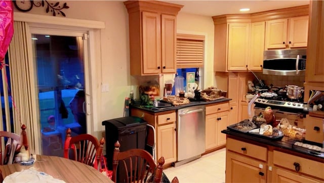145 Dartmouth Dr, Hicksville, NY 11801 - kitchen with stainless steel appliances, dark countertops, decorative backsplash, and recessed lighting