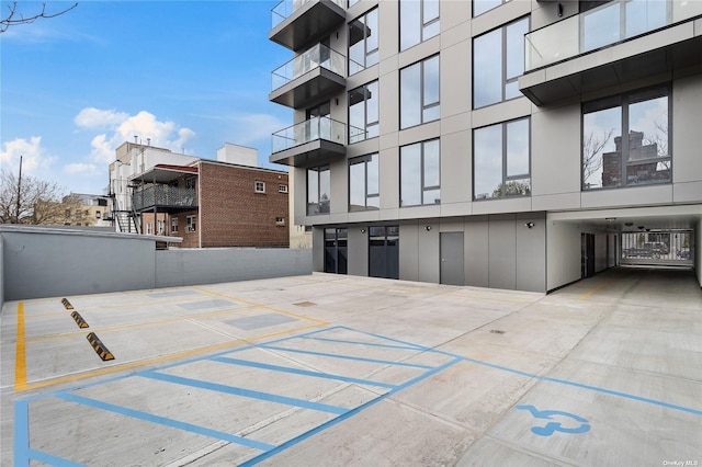 14-54 31st Ave Unit 3A, Astoria, NY 11106 - view of building exterior with uncovered parking