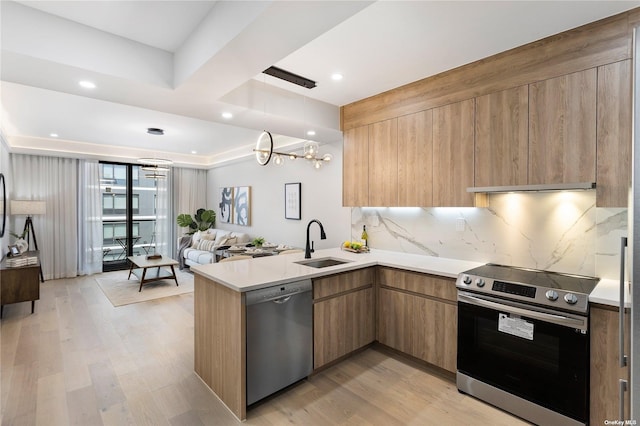 14-54 31st Ave Unit 3A, Astoria, NY 11106 - kitchen with stainless steel appliances, modern cabinets, open floor plan, a chandelier, and recessed lighting