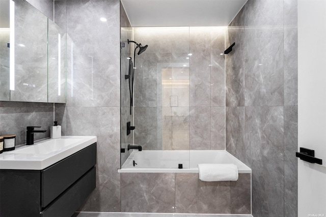 14-54 31st Ave Unit 3A, Astoria, NY 11106 - bathroom featuring tile walls, vanity, and tiled shower / bath combo