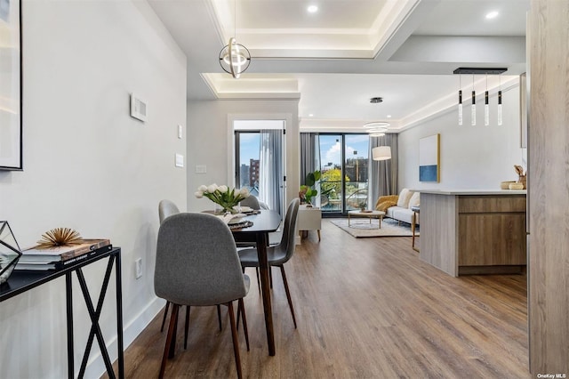 14-54 31st Ave Unit 3A, Astoria, NY 11106 - dining area with wood finished floors and a tray ceiling