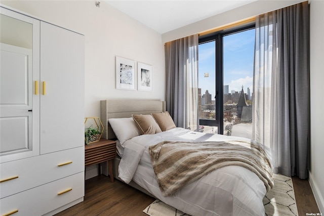 14-54 31st Ave Unit 3A, Astoria, NY 11106 - bedroom featuring dark wood-style floors and a view of skyline