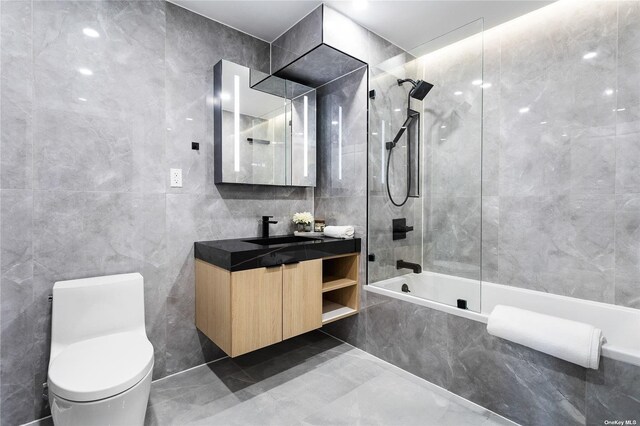 14-54 31st Ave Unit 3A, Astoria, NY 11106 - full bath with tile walls, vanity, a combined bath / shower with marble appearance, and marble tiled flooring