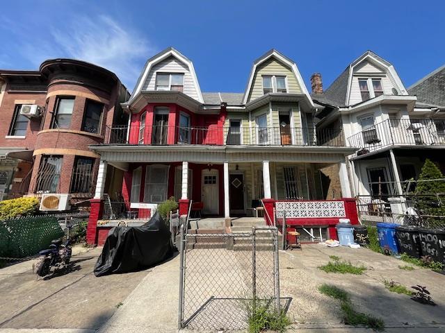 1405 36th St, Brooklyn, NY 11218 - view of front of property with a porch, a gambrel roof, and a balcony
