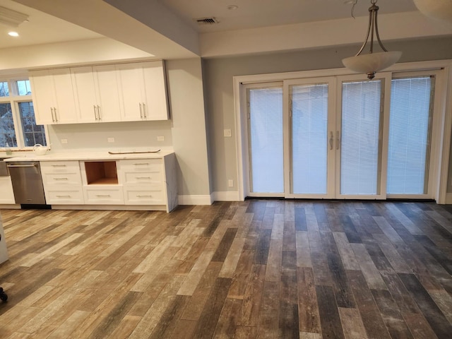 7 E Blvd, East Rockaway, NY 11518 - kitchen featuring white cabinets, wood-type flooring, dishwasher, light countertops, and recessed lighting