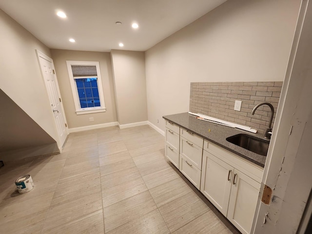 7 E Blvd, East Rockaway, NY 11518 - kitchen featuring tasteful backsplash, recessed lighting, and white cabinets