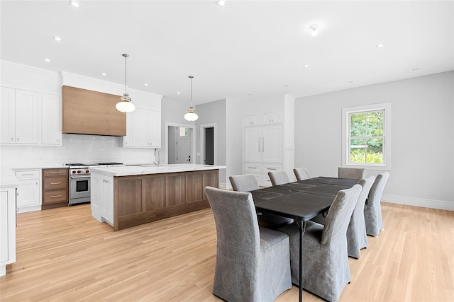 2 Herrick Ln, Southampton, NY 11968 - dining room with light wood-style flooring and recessed lighting