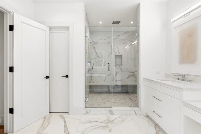 2 Herrick Ln, Southampton, NY 11968 - bathroom with marble look tiles, a marble finish shower, recessed lighting, and vanity