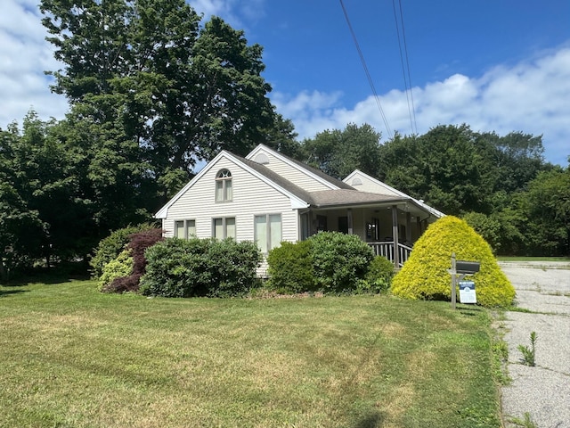 view of front of house with a front lawn and covered porch