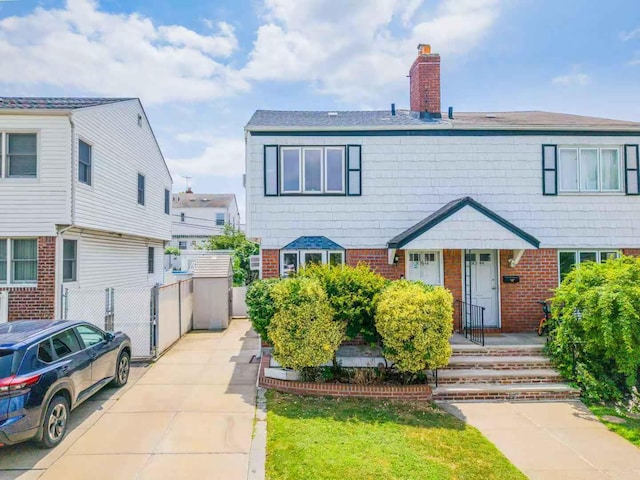 16346 21st Rd, Whitestone, NY 11357 - view of front of house featuring a chimney and brick siding