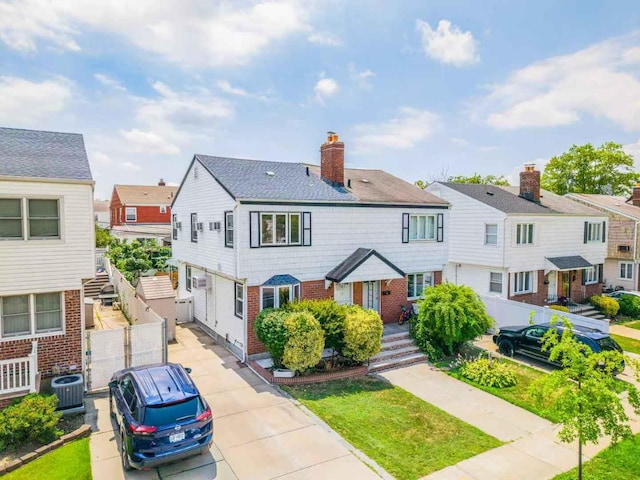 16346 21st Rd, Whitestone, NY 11357 - view of front of property with brick siding, a residential view, and a chimney
