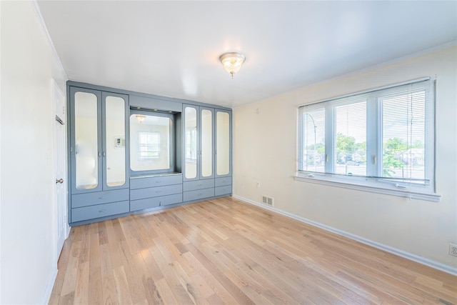 16346 21st Rd, Whitestone, NY 11357 - spare room with light wood finished floors and ornamental molding