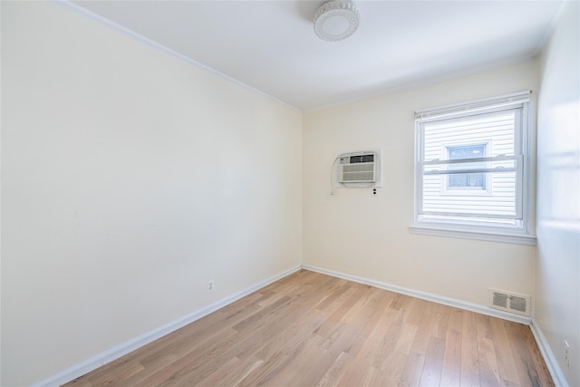 16346 21st Rd, Whitestone, NY 11357 - spare room featuring light wood-style flooring, ornamental molding, and an AC wall unit