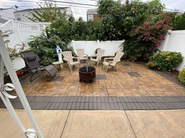 16346 21st Rd, Whitestone, NY 11357 - fenced backyard featuring a patio and a fire pit