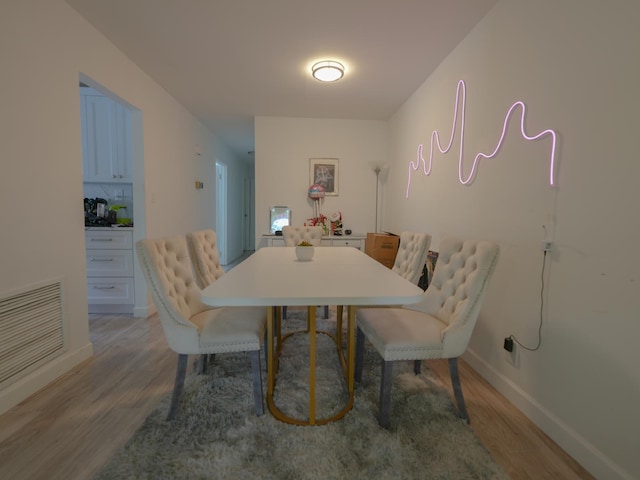 2725 E 65th St, Brooklyn, NY 11234 - dining space featuring light wood-style flooring and baseboards