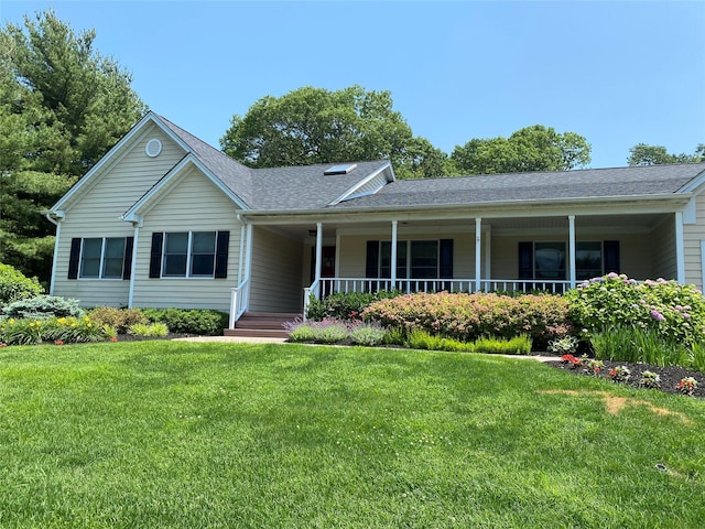 17 Wood Hollow Ln, Northport, NY 11768 - ranch-style house featuring a shingled roof, covered porch, and a front lawn