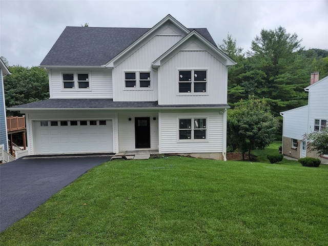 302 Washington Ave, Pleasantville, NY 10570 - view of front facade featuring asphalt driveway, an attached garage, a front yard, and a shingled roof