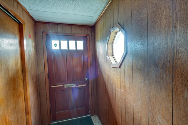 1435 Peters Blvd, Bay Shore, NY 11706 - doorway with wood walls and a textured ceiling