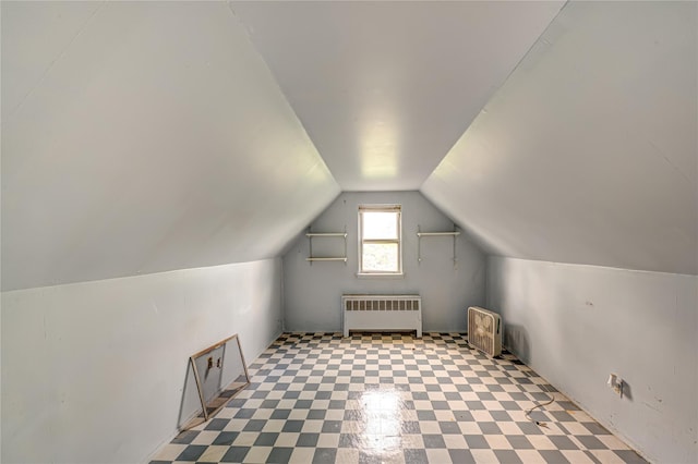 1435 Peters Blvd, Bay Shore, NY 11706 - additional living space with radiator, lofted ceiling, and tile patterned floors