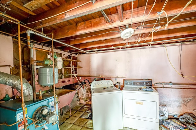 1435 Peters Blvd, Bay Shore, NY 11706 - washroom with washing machine and clothes dryer and a heating unit