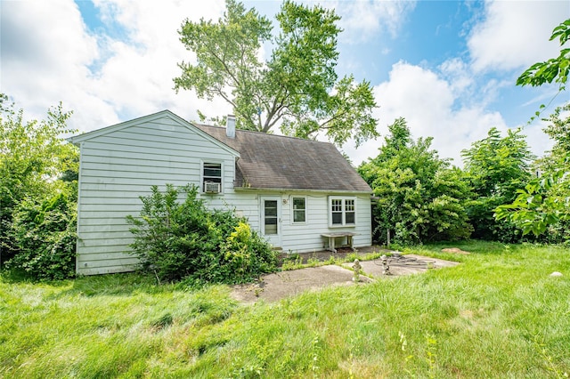 1435 Peters Blvd, Bay Shore, NY 11706 - back of house with a lawn, a chimney, and roof with shingles