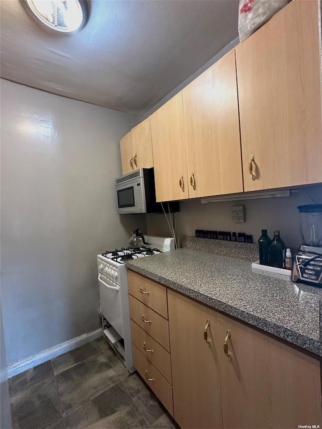 78-06 46th Ave Unit 6F, Elmhurst, NY 11373 - kitchen featuring light brown cabinetry and white appliances