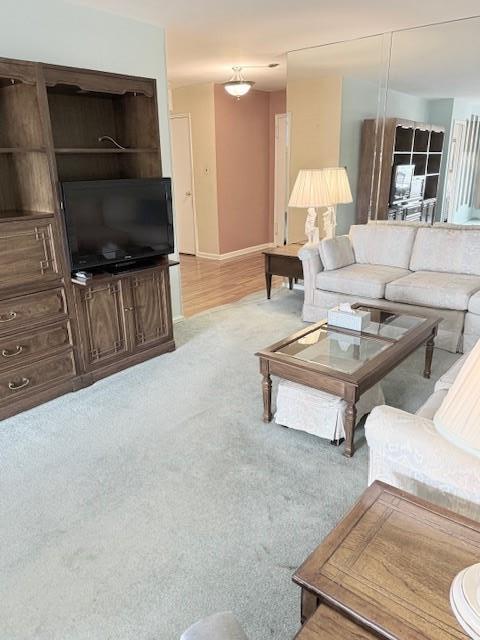 210-15 23rd Ave Unit 4E, Bayside, NY 11360 - living area featuring light carpet and baseboards